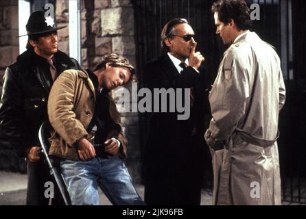 Kiefer Sutherland, Dennis Hopper & Cliff De Young Film: Flashback (1990) Characters: John Buckner,Huey Walker & Sheriff Hightower  Director: Franco Amurri 02 February 1990   **WARNING** This Photograph is for editorial use only and is the copyright of PARAMOUNT and/or the Photographer assigned by the Film or Production Company and can only be reproduced by publications in conjunction with the promotion of the above Film. A Mandatory Credit To PARAMOUNT is required. The Photographer should also be credited when known. No commercial use can be granted without written authority from the Film Comp Stock Photo