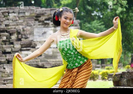 Indonesian traditional dancers with traditional clothes which are ...