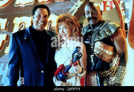 Tom Jones, Annette Bening & Jim Brown Film: Mars Attacks! (USA 1996) Characters: Himself,Barbara Land & Byron Williams  Director: Tim Burton 12 December 1996   **WARNING** This Photograph is for editorial use only and is the copyright of WARNER BROS. and/or the Photographer assigned by the Film or Production Company and can only be reproduced by publications in conjunction with the promotion of the above Film. A Mandatory Credit To WARNER BROS. is required. The Photographer should also be credited when known. No commercial use can be granted without written authority from the Film Company. Stock Photo