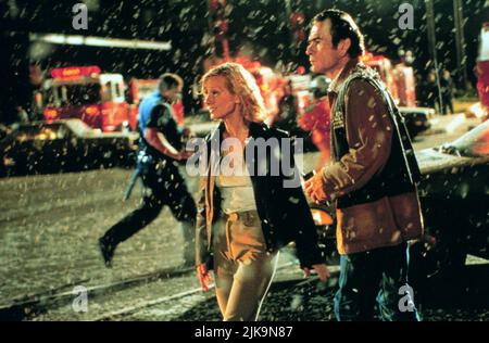 Anne Heche & Tommy Lee Jones Film: Volcano (USA 1997) Characters: Dr. Amy Barnes & Mike Roark  Director: Mick Jackson 25 April 1997   **WARNING** This Photograph is for editorial use only and is the copyright of 20TH CENTURY FOX and/or the Photographer assigned by the Film or Production Company and can only be reproduced by publications in conjunction with the promotion of the above Film. A Mandatory Credit To 20TH CENTURY FOX is required. The Photographer should also be credited when known. No commercial use can be granted without written authority from the Film Company. Stock Photo