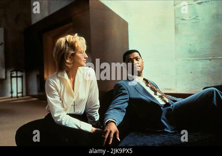 Ellen Barkin & Laurence Fishburne Film: Bad Company (USA 1995) Characters: Margaret Wells & Nelson Crowe / Narrator  Director: Damian Harris 20 January 1995   **WARNING** This Photograph is for editorial use only and is the copyright of TOUCHSTONE PICTURES and/or the Photographer assigned by the Film or Production Company and can only be reproduced by publications in conjunction with the promotion of the above Film. A Mandatory Credit To TOUCHSTONE PICTURES is required. The Photographer should also be credited when known. No commercial use can be granted without written authority from the Film Stock Photo