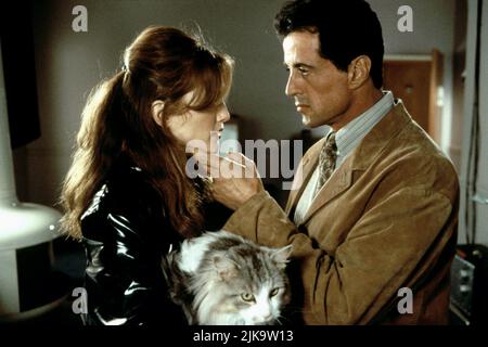 Julianne Moore & Sylvester Stallone Film: Assassins (USA/FR 1995) Characters: Electra & Robert Rath  Director: Richard Donner 06 October 1995   **WARNING** This Photograph is for editorial use only and is the copyright of WARNER BROS. and/or the Photographer assigned by the Film or Production Company and can only be reproduced by publications in conjunction with the promotion of the above Film. A Mandatory Credit To WARNER BROS. is required. The Photographer should also be credited when known. No commercial use can be granted without written authority from the Film Company. Stock Photo