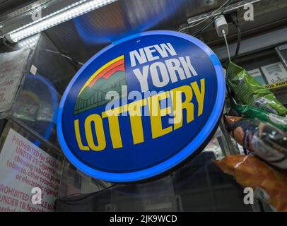 NEW YORK, N.Y. – July 29, 2022: A New York Lottery sign is seen at a newsstand in Lower Manhattan. Stock Photo