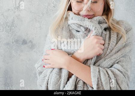 winter coziness peaceful woman knitted blanket Stock Photo