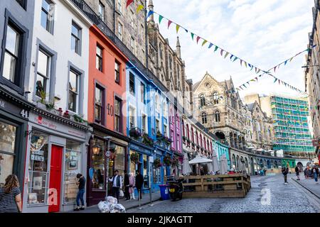 Victoria street Edinburgh Old Town on summers day in 2022, brightly coloured retail stores and traditional architecture,Scotland,UK,Europe Stock Photo