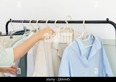 aesthetic laundry concept clothes hung on a hanger Stock Photo