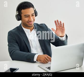 Lucky man, fire in my hands. a businessman on a video call in a modern office. Stock Photo