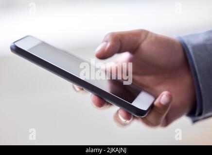 Ill make a few calls to get the ball rolling. an unrecognizable man using his cellphone. Stock Photo