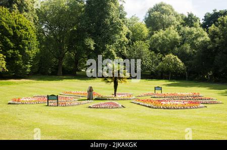 Two women admiring the floral display in Roundhay Park, Leeds, Yorkshire, England, UK Stock Photo