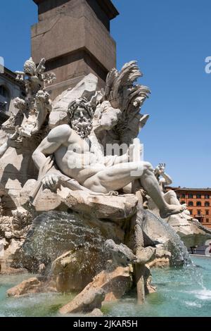 ROME, ITALY - JULY 16 2022: Fontana dei Quattro Fiumi (Fountain of the Four Rivers) with obelisk on the Piazza Navona, designed by Bernini Stock Photo