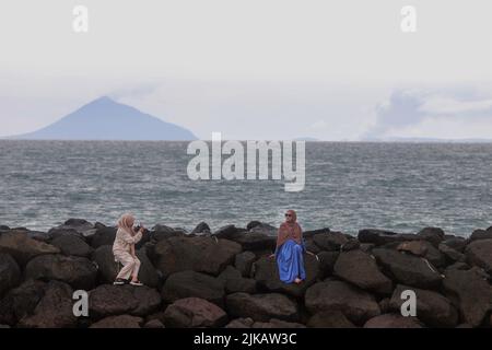 Women seen taking photos at Cidatu Beach Carita Pandeglang