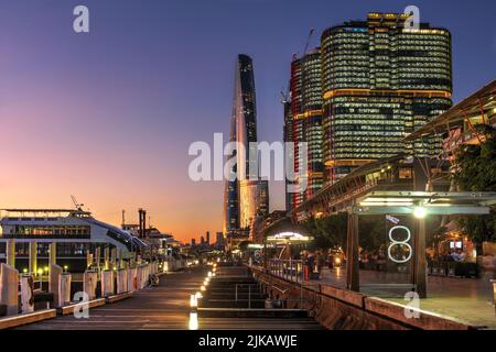 Gorgeous sunset in Barangaroo distric of Sydney, Australia along the King Street Wharf with recently completed Crown Sydney (One Barangaroo) skyscrape Stock Photo