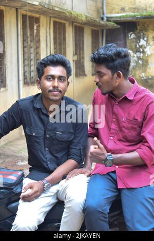 Collage of young handsome Indian man with arms crossed Stock Photo - Alamy