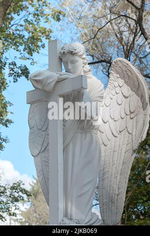 Tomb sculpture of white angel in Lychakiv Lviv, Ukraine Stock Photo