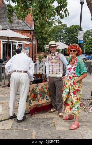 People dressed in 1940's garments enjoying the day at The Lawn Lincoln 1940's weekend, Lincoln Cathedral Quarter, 23rd July 2022 Stock Photo