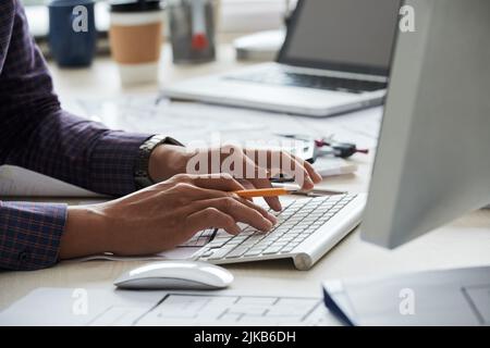 Hands of architect working on computer on new project Stock Photo