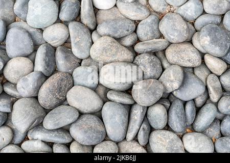 Abstract sea or river pebbles background with a smooth texture, stock phot image Stock Photo