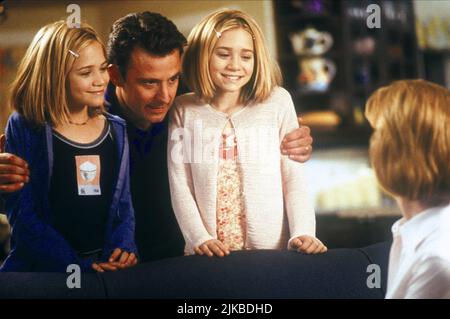 Mary-Kate Olsen, Eric Lutes & Ashley Olsen Film: Switching Goals (1999) Characters: Samantha 'Sam' Stanton, Jerry Stanton, Emma Stanton  Director: David Steinberg 12 December 1999   **WARNING** This Photograph is for editorial use only and is the copyright of DISNEY and/or the Photographer assigned by the Film or Production Company and can only be reproduced by publications in conjunction with the promotion of the above Film. A Mandatory Credit To DISNEY is required. The Photographer should also be credited when known. No commercial use can be granted without written authority from the Film Co Stock Photo