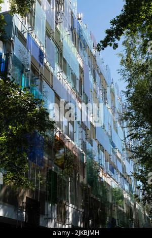 Complex outside mantle consisting of colored glasses, stacked on top of each other, a relief composed of colors and shapes in Novartis' new office Stock Photo