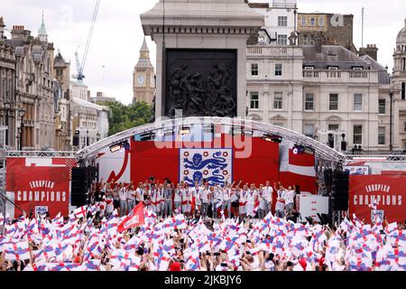 England players sing Sweet Caroline on stage during a fan celebration