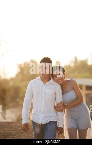 Happy young Vietnamese couple having romantic date Stock Photo