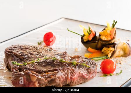 chef main course rare steak vegetable garnish Stock Photo
