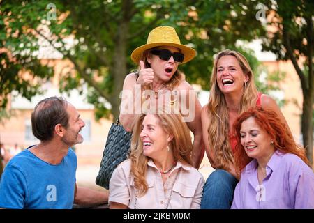 Five mature adults having fun in a park. Stock Photo