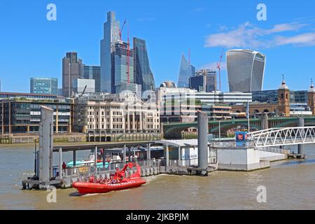 Bankside south of the river, looking over to the City of London, with red Thames Rocket RIB boat, in the foreground, London, England, UK, SE1 9DT Stock Photo