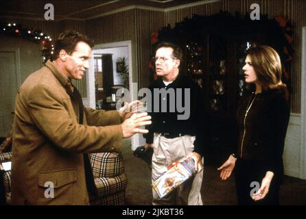 Arnold Schwarzenegger, Phil Hartman & Rita Wilson Film: Jingle All The Way (USA 1996) Characters: Howard Langston, Ted Maltin, Liz Langston  Director: Brian Levant 16 November 1996   **WARNING** This Photograph is for editorial use only and is the copyright of 20TH CENTURY FOX and/or the Photographer assigned by the Film or Production Company and can only be reproduced by publications in conjunction with the promotion of the above Film. A Mandatory Credit To 20TH CENTURY FOX is required. The Photographer should also be credited when known. No commercial use can be granted without written autho Stock Photo