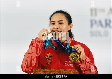 Surakarta, Indonesia. 1st Aug, 2022. Ni Nengah Widiasih of Indonesia poses with her gold medal after winning the women's up to 45kg powerlifting final at the 2022 ASEAN Para Games in Surakarta, Indonesia, Aug. 1, 2022. Credit: Agung Kuncahya B./Xinhua/Alamy Live News Stock Photo
