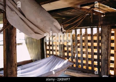 Wooden winch of a sailing ship and ropes on the deck of medieval pirate warship Stock Photo