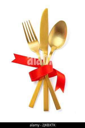 Cutlery tied with red ribbon on white background, Stock Photo