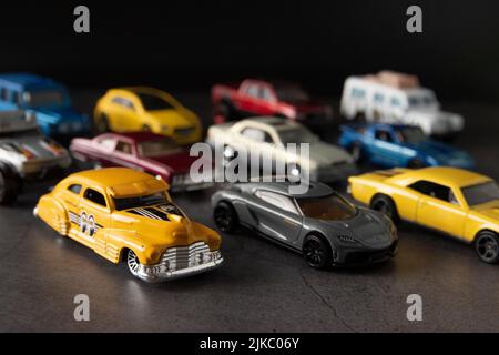 Many colorful miniature car models reminding childhood memories Stock Photo