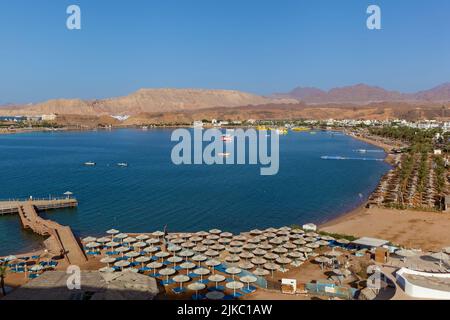 Coastline, Red Sea beaches and Sinai Mountains in the background. Travel and tourism in Egypt old city Stock Photo