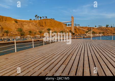 Coastline, Red Sea beaches and Sinai Mountains in the background. Travel and tourism in Egypt old city Stock Photo