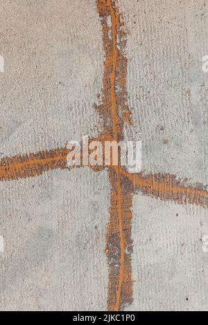 A top view of cracks repaired with epoxy mortar on the freshly sanded concrete floor Stock Photo