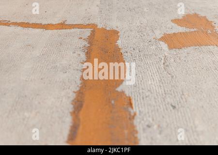 A view of cracks repaired with epoxy mortar on the freshly sanded concrete floor Stock Photo
