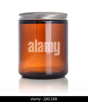 Brown empty cosmetic glass jar isolated on white background. Clipping path included. Stock Photo