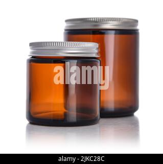 Brown empty cosmetic glass jar isolated on white background. Clipping path included. Stock Photo