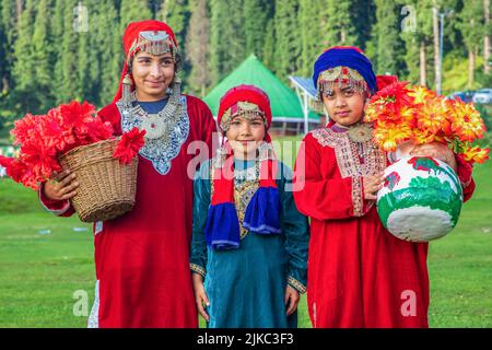 India, Jammu & Kashmir, Ladakh, Nubra valley, Sumur road, Ladakhi women  with traditional dress returning from a local festival. - SuperStock