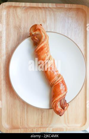 bacon twists , bacon cheese twists or Bacon and Cheese Straws or Cheesy Bacon Wrapped Puff Stock Photo