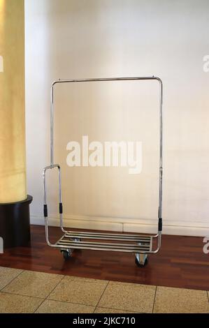 Lonely baggage cart standing beside the hotel lobby Stock Photo