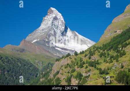 The Matterhorn peak over Mattertal valley in Valliser alps. Stock Photo