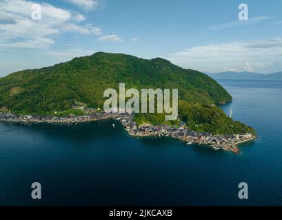 Aerial view of houses nestled along coast in Ine, Kyoto Stock Photo