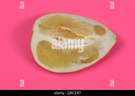 Perfectly retouched pomelo on pink background. High resolution photo. Full depth of field. Stock Photo