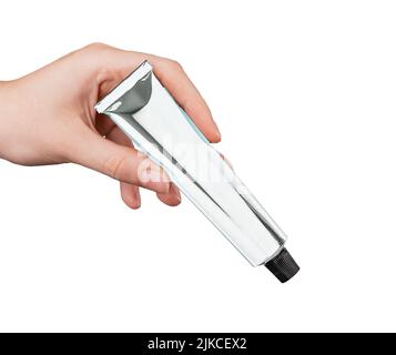 Hand with cream, ointment tube mockup isolated on white background. Product for skin care or irritation, infection treatment. Wellness, beauty concept. High quality photo Stock Photo