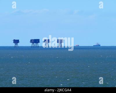 Sheerness, Kent, UK. 1st Aug, 2022. Knock John naval fort was sunk in the Thames Estuary several miles out to sea 80 years ago today. To celebrate Margaret McEwan (a Maunsell Forts enthusiast) arranged for historic tug steam tug Challenge to revisit the fort it helped to position 80 years ago. Ms McEwan was aboard X-Pilot vessel with members of the Sealand 'Royal Family' to mark the occasion. PIC: Challenge (large vessel) and X-Pilot pass the Red Sands Sea Forts (also designed by Guy Maunsell). Credit: James Bell/Alamy Live News Stock Photo