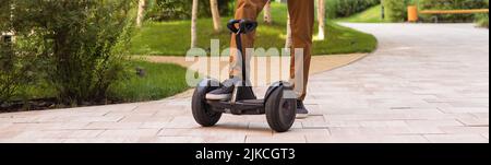 Person Riding a HoverBoard on a Public Footpath, They are now banned in all public places Stock Photo