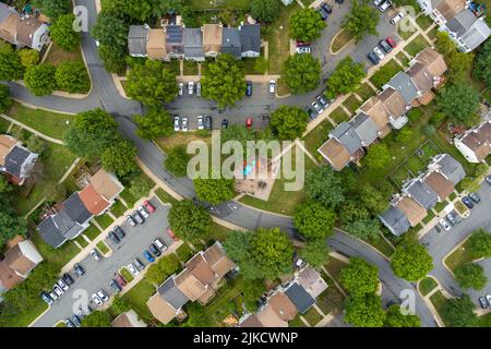 Top-down aerial view of a residential neighborhood in Rockville, Montgomery County, Maryland. The parking lots are near capacity on a weekday as peopl Stock Photo