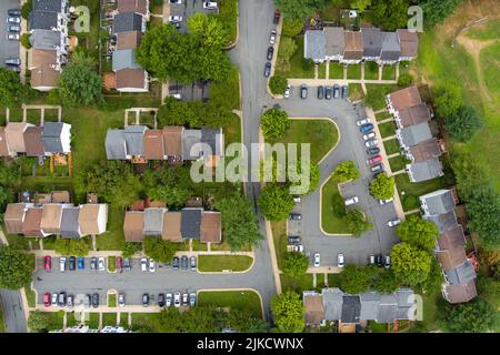 Top-down aerial view of a residential neighborhood in Rockville, Montgomery County, Maryland. The parking lots are near capacity on a weekday as peopl Stock Photo